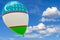 Balloon with the image of the national flag of Uzbekistan, flying through the blue sky. 3D rendering, illustration with copy space