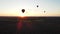 balloon moves against the background of the setting sun in the evening. aerial sunset