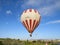 Balloon with tourists approaching the clearing to land