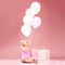Balloons, birthday and girl on pink background for celebration, party and special day in studio. Happy, wonder and