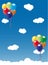 Balloons floating in blue sky