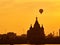 Balloons fly over the city. Warm summer evening. Balloon Festival