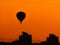 Balloons fly over the city. Warm summer evening. Balloon Festival