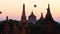 Balloons flying over ancient Buddhist Temple silhouette at Bagan. Myanmar (Burma)