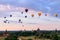 Balloons flying over the pagodas at sunrise at Bagan, Myanmar