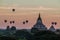 Balloons over Bagan and the skyline of its temples, Myanmar. Sulamani temple and Shwesandaw pagod