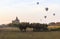 Balloons over Bagan at sunrise with horses