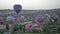 Balloons prepare for take-off before sunrise.