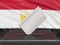 Ballot box with Egyptian flag on background