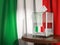 Ballot box with flag of Italy and voting papers.Italian resident