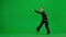 Ballroom Dancer Poised for Performance on Green Screen