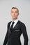 Ballroom dancer in stylish tuxedo. Man in elegant suit with tie. Groom dressed for wedding or holiday celebration. Dress code for