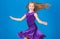 Ballroom fashion. Girl child wear velvet violet dress. Kid fashionable dress looks adorable. Ballroom dancewear fashion