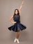 Ballroom teenager dancer isolated on studio grey background. Latin classic dance. Rumba, samba dancing pose. Ballroom