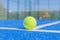 a balls in a blue paddle tennis court, racket sports