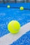 balls in a blue paddle tennis court, racket sports concept