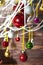 Balls colorfull christmas ornaments hanging from christmas tree on wooden board