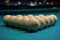 Balls for Russian Billiards are lined with a pyramid at the beginning of the game. white balls on a green table. serious sport,