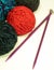 Balls of Yarn and Knitting Needles