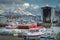 Ballstad dockyard with fisherboats in front of snowcoverd mountains