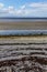 Ballyloughane Beach with rocks and seaweeds