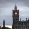 The Balmoral Hotel historical building in Edinburgh, Scotland, during a cloudy autumn morning.