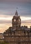 The Balmoral Hotel historical building in Edinburgh, Scotland, during a cloudy autumn morning.