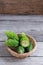 Balsam apple, Balsam pear, Bitter cucumber , Bitter gourd , Stuffed bitter gourd, karela on wood background