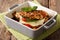 Balsamic chicken stuffed with caprese close-up in a baking dish.