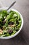 Balsamic Spinach Salad with fork in white bowl