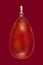 Baltic amber closeup on red background