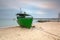 Baltic beach in Gdynia Orlowo with fishing boat at dawn, Poland