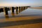 Baltic coast at sunset, breakwater, beach, Kolobrzeg, Poland.