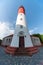 Baltic lighthouse, red white colors, bottom view. Most western russian lighthouse in Baltiysk city. Beautiful sunny weather