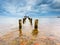 Baltic rocky coast with old military buildings from world war II and wooden breakwaters.