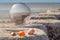 Baltic Sea beach through a glass sphere lying with amber on a groyne