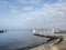 Baltic sea with empty harbor and small lighthouse