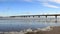 Baltic Seaside With Sea Wave And Long Bridge With Foam