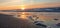 Baltic sunset among waves