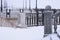 Balustrade of the rotunda under the snow. Gray granite exterior details during a snowfall. Fragment of a city landmark