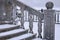 Balustrade of the rotunda under the snow. Gray granite exterior details during a snowfall. Fragment of a city landmark