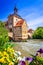 Bamberg, Bavaria - Half-timebered town hall and bridge decorated by flowers, Germany