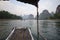 On a bamboo boat traveling along the Li River, Yangshuo, Guilin, China