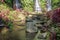 The bamboo bridge in waterfall. Wooden bridge on the way to Two waterfall hidden in jungle in north Bali. Landscape of nature in s