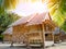 Bamboo bungalow resort with coconut leaf foreground.