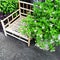 Bamboo chair and blooming plants