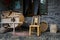 Bamboo chair and wooden thresher outside farmhouse