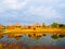 Bamboo cottages and and thier reflections in pond in Nakorn Ratchasima,Thailand