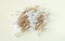 Bamboo cotton swabs buds sticks top view on beige background