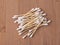 Bamboo cotton swabs on wooden table